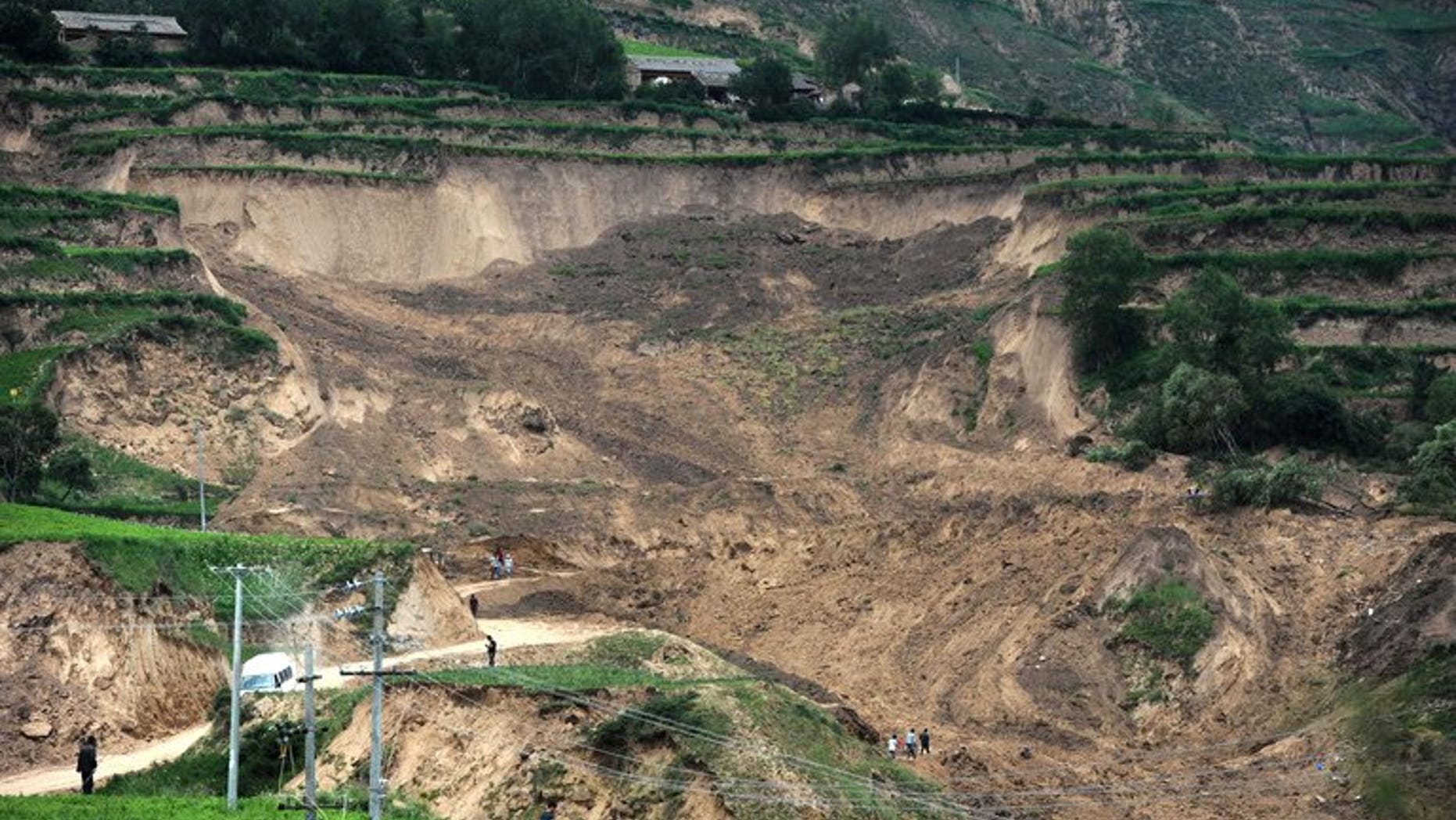 Debris left by a landslide triggered after the recent earthquakes in Minxian county in Dingxi, northwest China's Gansu province, seen on July 24, 2013. Nine people were buried and four missing after landslides hit Gansu province where at least 95 were killed this week by the quakes, state media reported on Friday.
