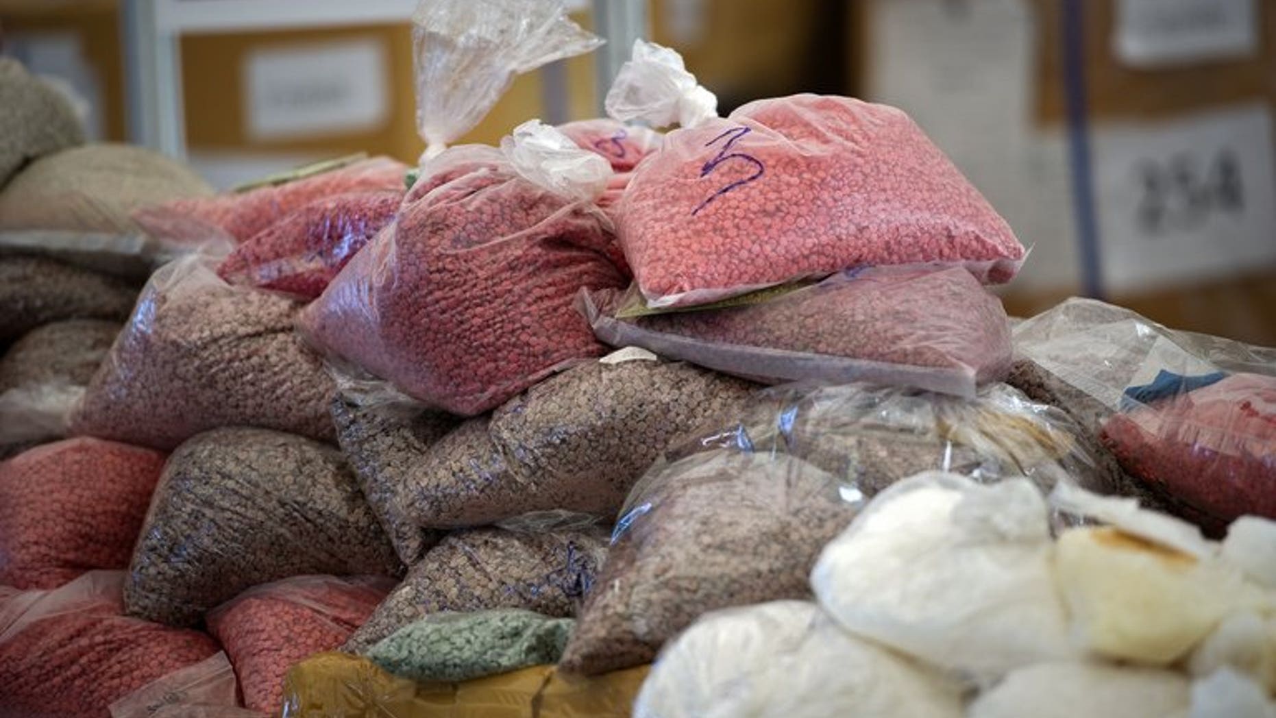 Bags of methamphetamine pills seized by the Thai narcotic police department are seen on display before being incinerated in Ayutthaya on September 17, 2011. Two Indian men have been arrested and charged in Thailand with trafficking crystal methamphetamine worth an estimated $1.4 million, a customs official said Friday.
