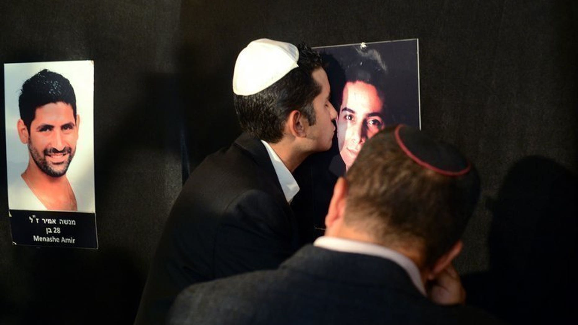 Relatives of five Israeli victims of the July 2012 Bulgaria bus bombing mourn during a ceremony in Sofia on August 28, 2012. Hezbollah's armed wing wired almost $100,000 (75,000 euros) to two men wanted over a bomb attack that killed the five Israeli tourists in Bulgaria last year, a newspaper report said Friday.