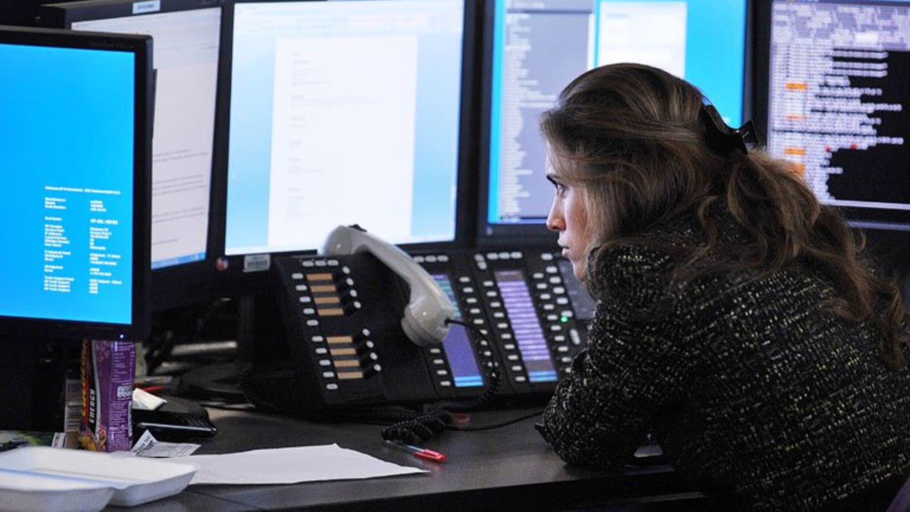 A broker monitors market movements at BGC Partners in London. London shares closed lower on Friday as BSkyB stock sank in the wake of the satellite broadcaster's results for its year to June.
