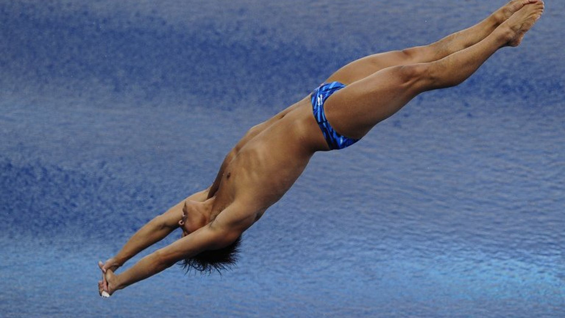 China's He Chong competes in the men's 3-metre springboard final diving event in the FINA World Championships at the Piscina Municipal de Montjuic in Barcelona on July 26, 2013.