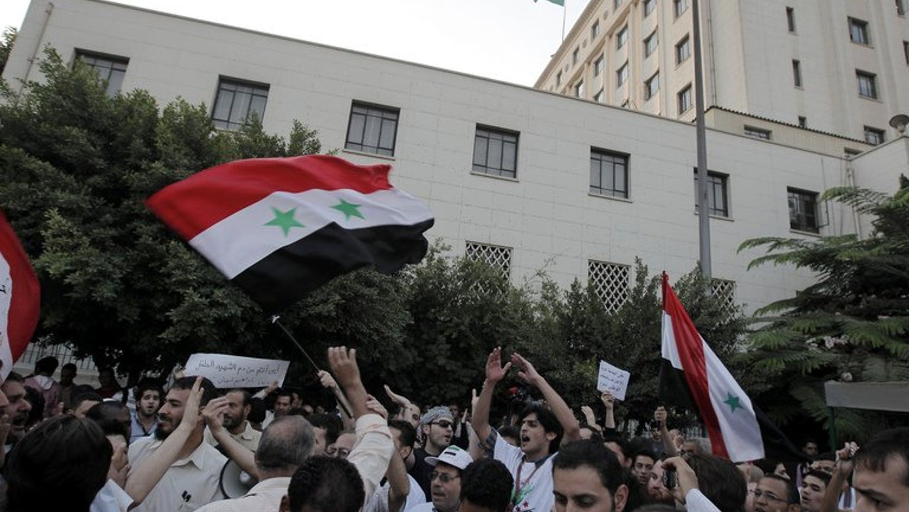 Syrians living in Egypt protest against President Bashar al-Assad in Cairo on October 16, 2011. Rising anti-Syrian rhetoric and arbitrary arrests are pushing a growing number of Syrian war exiles in Egypt to seek UN protection, the world body's refugee agency said Friday.