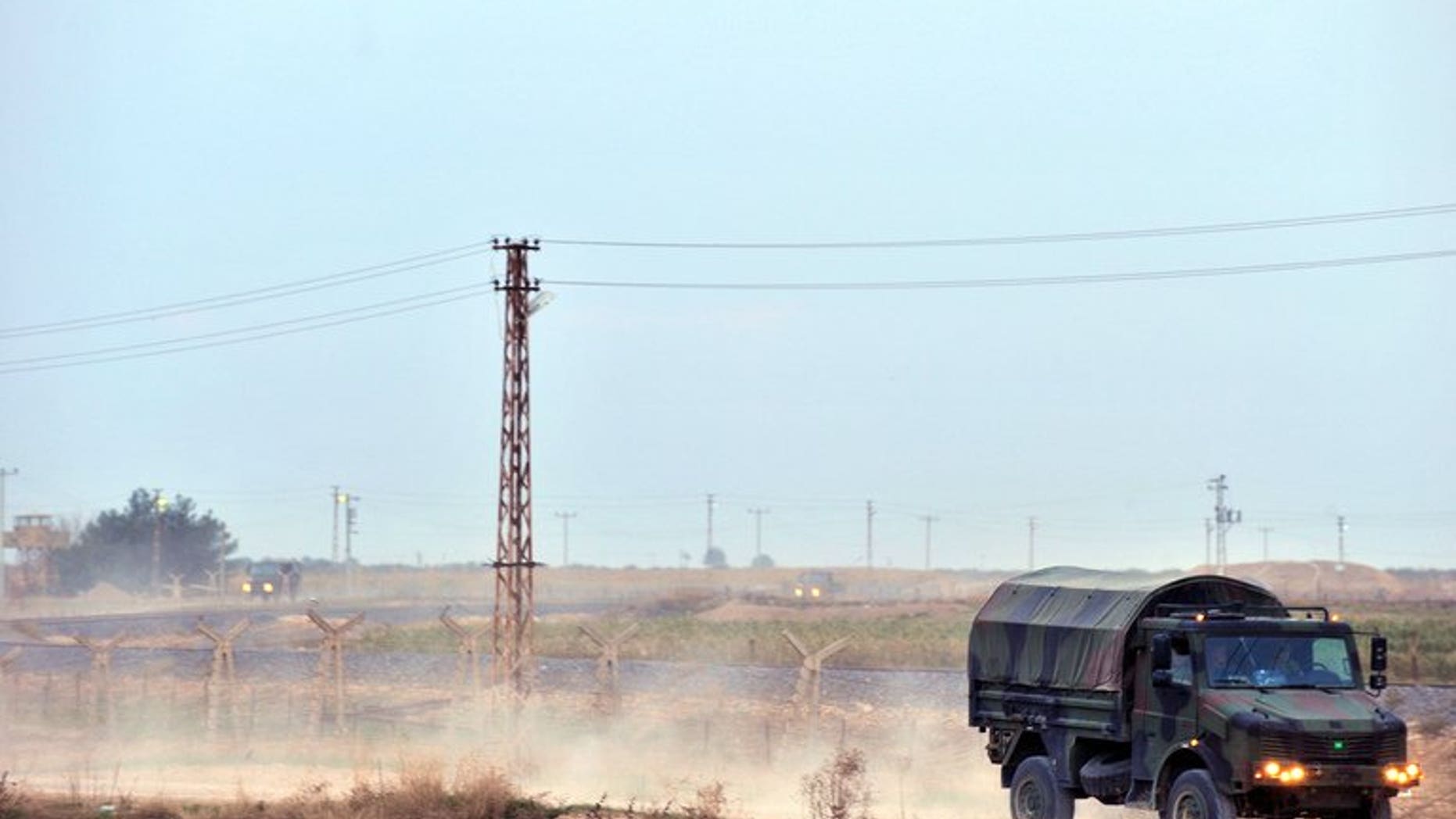 Turkish soldiers patrol on the Turkish-Syrian border near the town of Ceylanpinar on November 11, 2012. A man was killed and his three children wounded Friday in southeastern Turkey by a mortar shell fired from across the border with conflict-torn Syria, a newspaper reported.