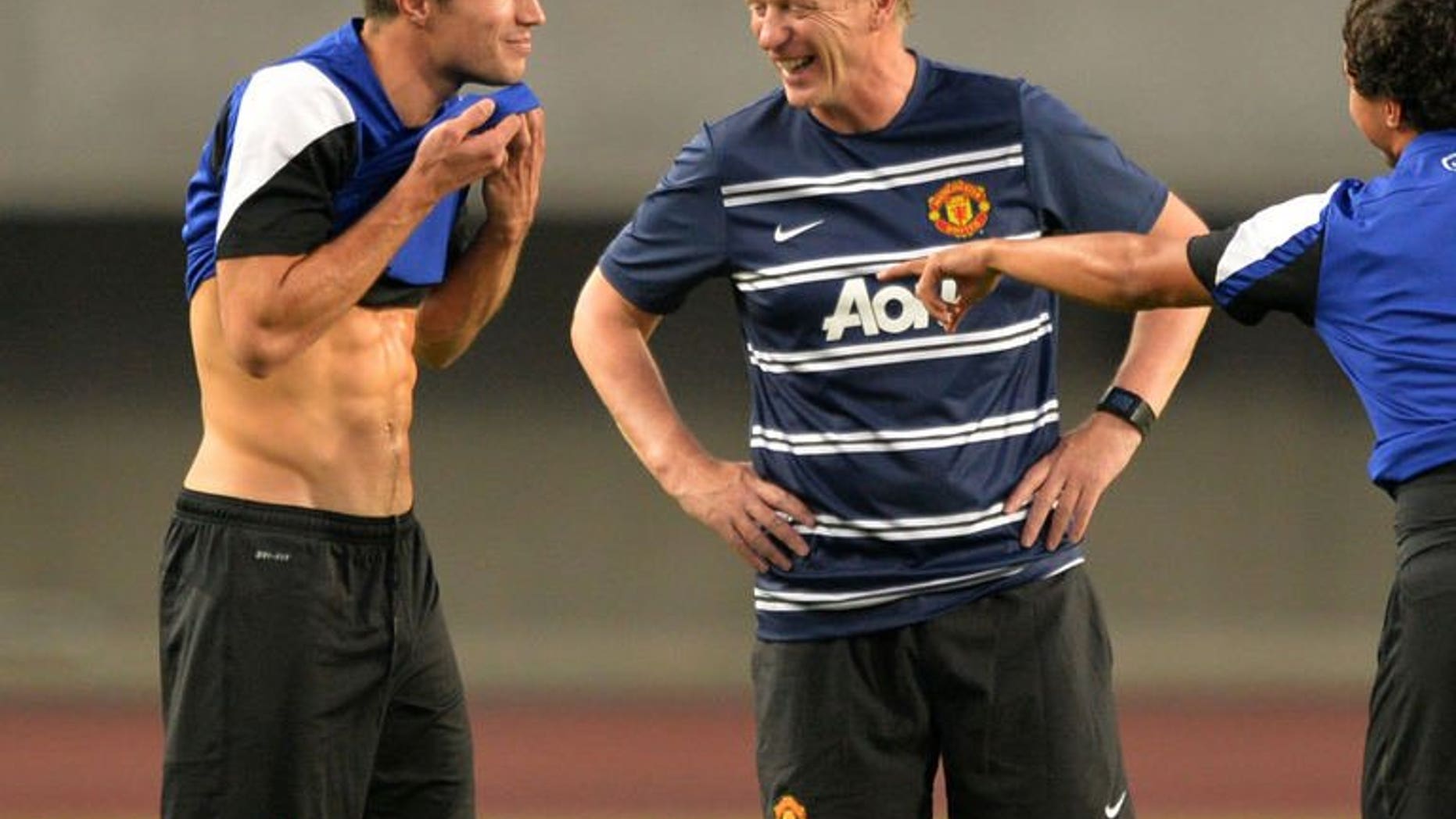 English Premier League football team Manchester United manager, David Moyes and player Robin van Persie (left) at Nagai Stadium, Japan on July 25, 2013. Moyes admitted he is concerned about the pitch in Hong Kong, where his side landed Saturday on the last leg of their Asia tour.