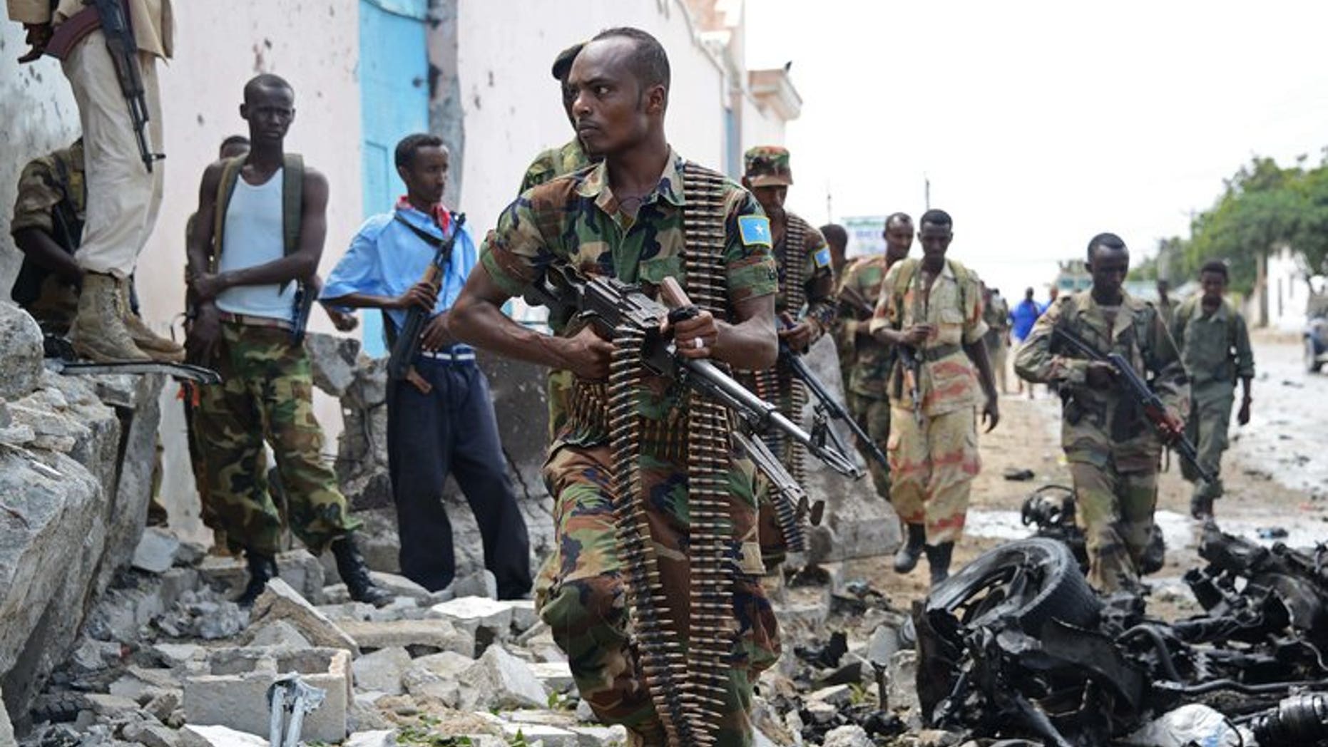 Somali National Government (SNG) soldiers are pictured after Al-Qaeda linked Shebab insurgents shot and blasted their way into the United Nations (UN) compound in Mogadishu on June 19, 2013. At least one person was killed Saturday when a car bomb exploded in Somalia's capital, the latest in a string of attacks, a local official said.