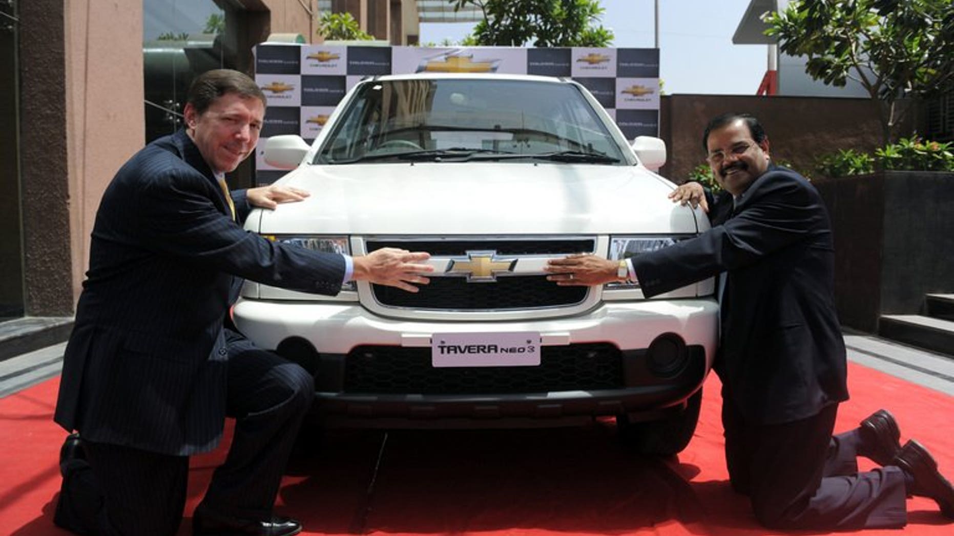 General Motors India's president and managing director Lowell Paddock (left) and vice president of corporate affairs GM India P Balendran in Ahmedabad on March 23, 2012. GM said Saturday it has fired "several employees" after violations of company policy led to the recall of 114,000 of its Chevrolet Tavera sport-utility vehicles in India.