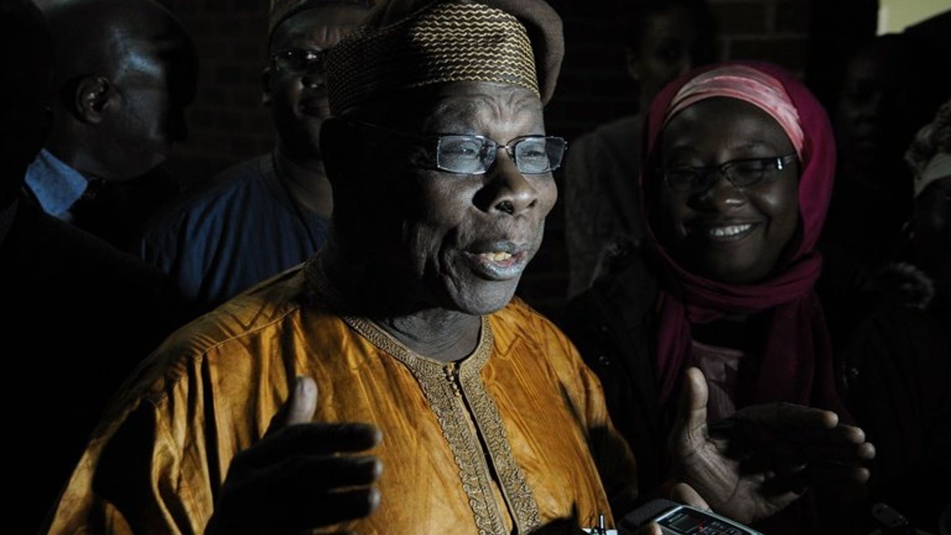 Former Nigerian president Olusegun Obasanjo (C) addresses the media upon arrival in Harare, on July 27, 2013. Obasanjo is to lead a team of 60 African Union monitors for Zimbabwe's July 31 election.