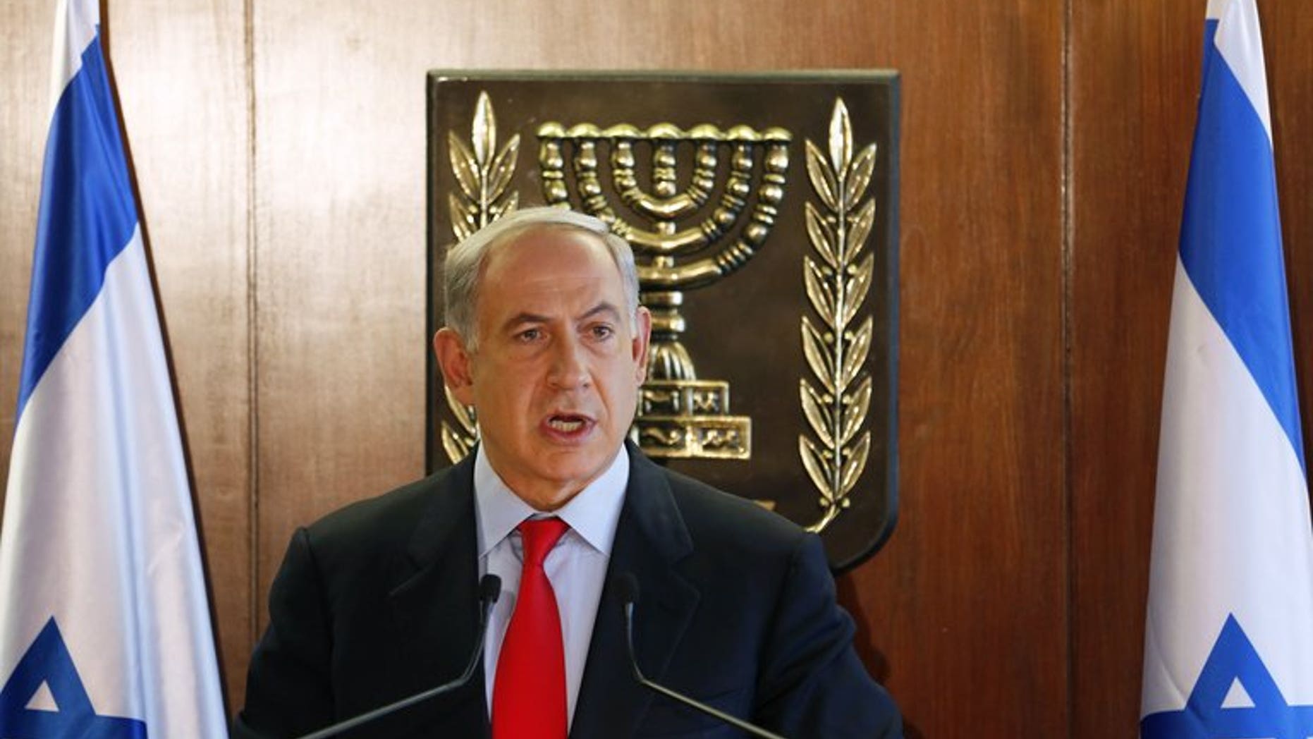 Israel's Prime Minister Benjamin Netanyahu delivers a statement to the media, in Jerusalem, on July 22, 2013. He will seek cabinet approval on Sunday for a contentious release of 104 veteran Palestinian and Israeli-Arab prisoners, to coincide with the resumption of peace talks.