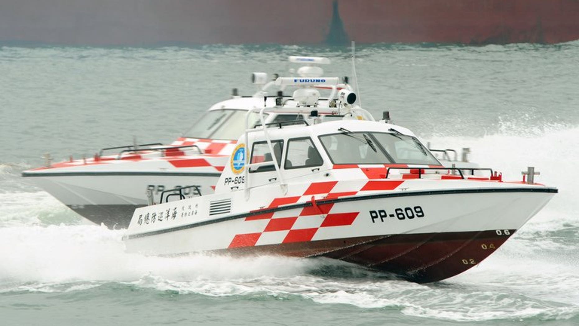 In this file photo, Taiwan coastguard's speed-boats demonstrate their combat skills during a drill near New Taipei City, on June 29, 2011. The coastguard on Saturday raided a fishing vessel thousands of miles offshore, arresting nine Indonesian crew suspected of murdering their Taiwanese captain and chief engineer, according to officials.