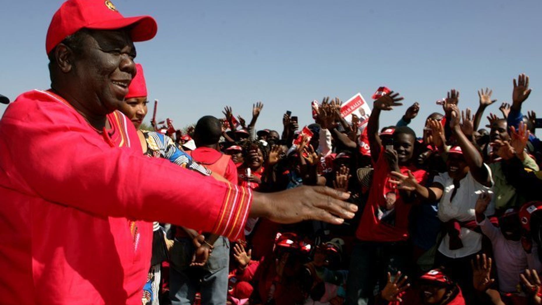 Zimbabwe PM Morgan Tsvangirai addresses an election campaign rally at Mkoba Stadium in Gweru on July 21, 2013. Zimbabwean police on Sunday arrested the election organiser of Prime Minister Morgan Tsvangirai's party after he reported marked ballot papers were found in a dustbin following early voting, the party and police said.