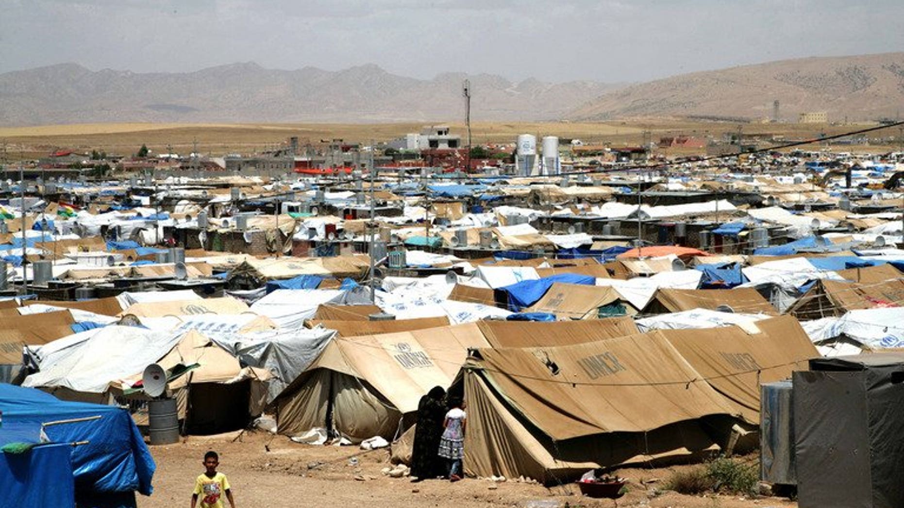 The Domiz refugee camp, which houses Syrian-Kurd refugees, near the Iraqi city of Dohuk. The head of the main Syrian Kurdish party said Sunday that Turkey had changed its position and would provide the Kurds in the war-ravaged country with humanitarian aid.