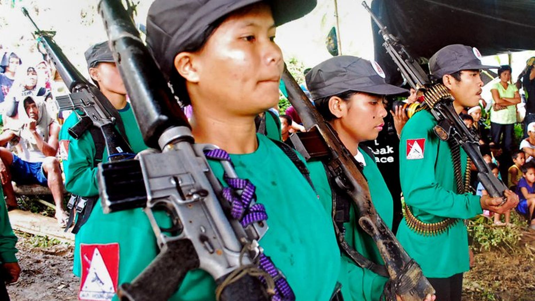 New People's Army rebels drill at an unspecified location in Surigao del Sur province, Mindanao, in December 2009. Philippine police and troops Sunday captured a woman who is one of the country's most wanted communist guerrillas, officials said.