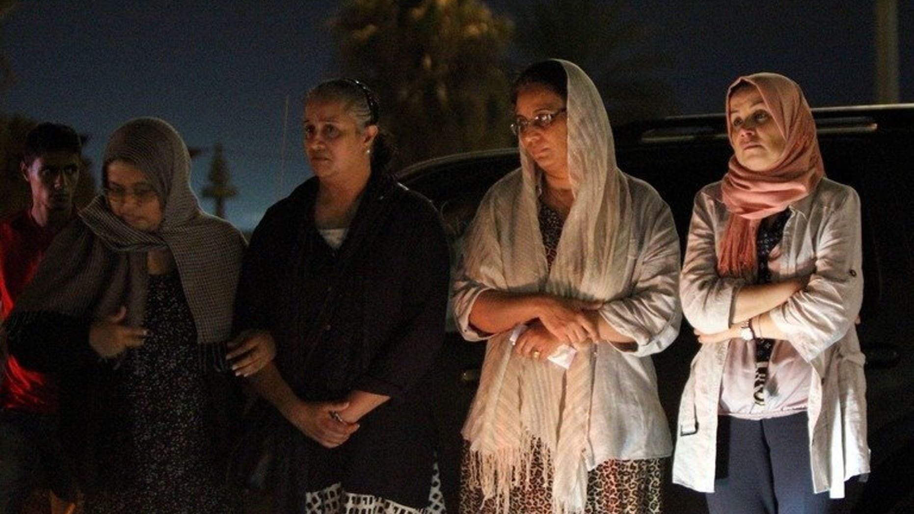 Benghazi residents gather in front of the Tibesti hotel following the assasination of a prominent Libyan political activist on July 27, 2013. Two powerful explosions went off near the courthouse in Benghazi Sunday night, leaving 10 people injured and causing damage, witnesses and a security source said.