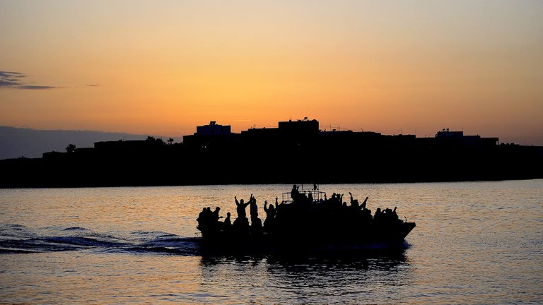 A boat carring Tunisian migrants enters the port of Lampedusa on April 12, 2011. Italian Interior Minister Angelo Alfano called for human traffickers who shuttle migrants across the sea to Italy to be stopped on Sunday, after 31 boat people drowned during an attempted crossing.