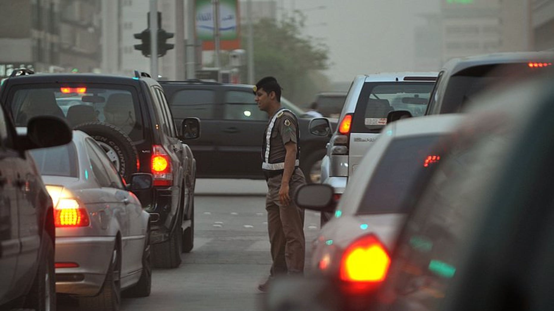 File picture shows a Saudi policeman monitoring traffic in Riyadh. Saudi Arabia has granted three foreign consortiums contracts to build a Riyadh metro, a project worth $22.5 billion, the kingdom announced at a news conference in the capital late on Sunday.