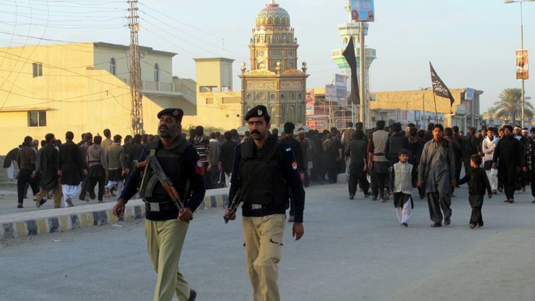 Pakistani policemen are seen in the city of Dera Ismail Khan on November 25, 2012. Militants attacked a prison in the city armed with mortars and are locked in a gunfight with police and security forces, officials said.