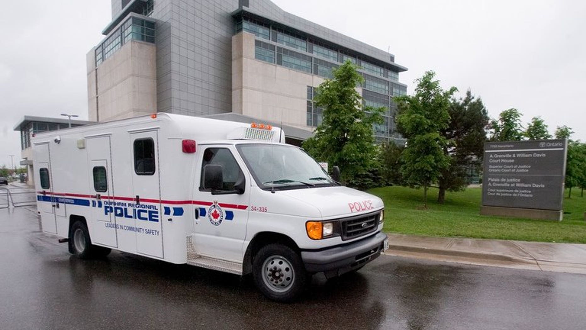 File picture shows a Toronto police van. Canadians demanded answers in the wake of a fatal police shooting of a knife-wielding teenager in Toronto that has sparked an uproar.