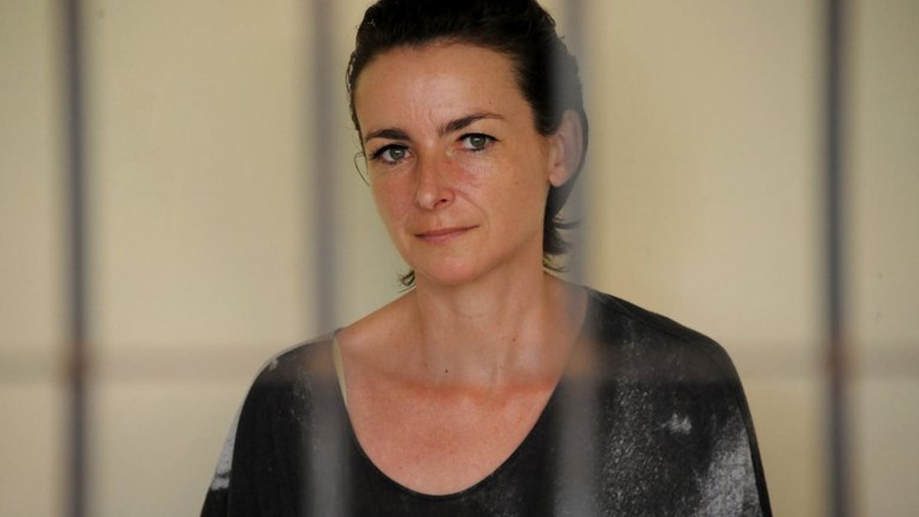 Rachel Dougall waits inside a holding cell before her sentencing at a court in Denpasar, Bali on December 20, 2012. The warden of a notorious Indonesian prison has strongly denied claims by former inmate Dougall that she had been abused and that the jail was rife with drug use.