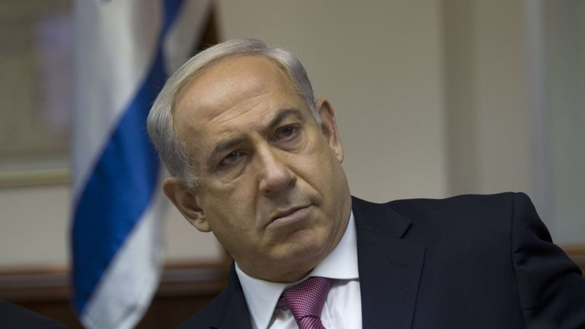 Israel's Prime Minister Benjamin Netanyahu (C) attends the weekly cabinet meeting in Jerusalem on July 28, 2013. As senior Israeli and Palestinian envoys resumed long-stalled peace talks in Washington, Israeli media questioned the motives of Netanyahu in taking to the negotiating table.