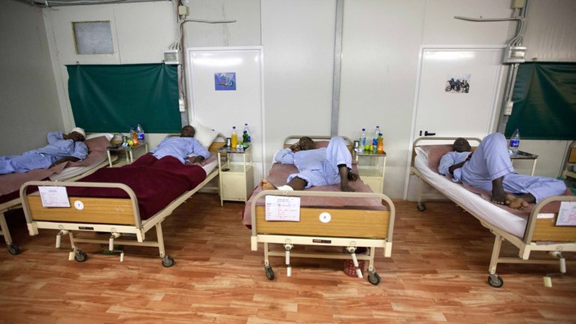 A picture released by the United Nations-African Union Mission in Darfur (UNAMID) shows wounded military personnel at a hospital in Nyala, Sudan, on July 14, 2013. An Arab tribe in Darfur says it killed 100 members of a rival tribe, adding to a mounting death toll from an upsurge in violence this year.
