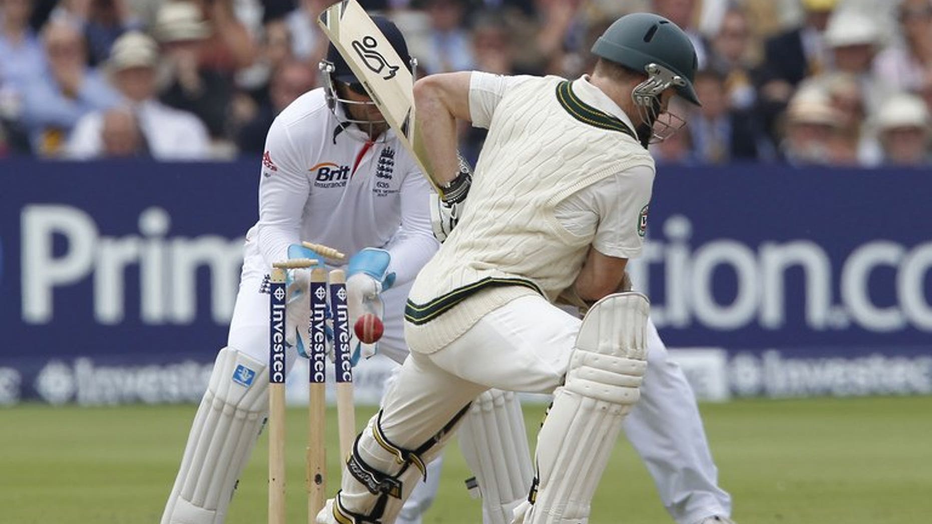 Chris Rogers is bowled by England's Graeme Swann (not pictured) at Lord's on July 21. Rogers said on Tuesday that Australia could only benefit from David Warner's return, even though the opener may have to make way if his fellow left-hander plays in the third Test against England.
