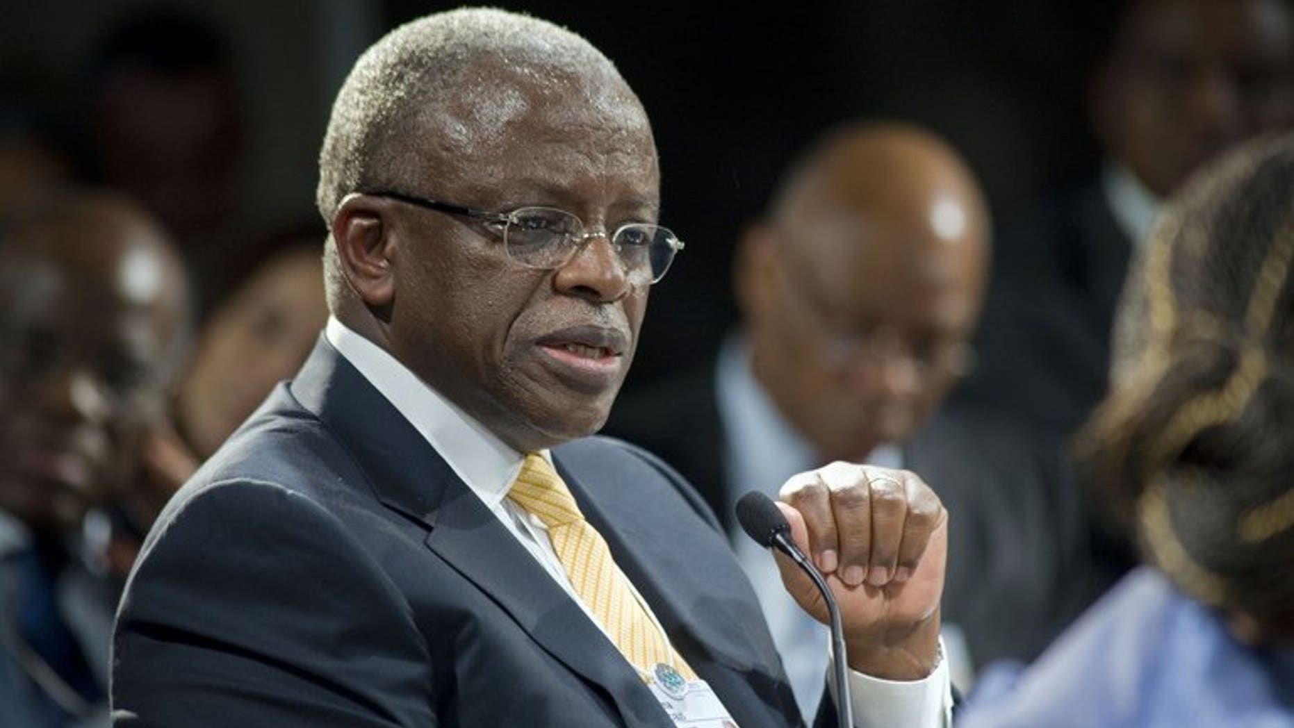 Uganda's Prime Minister Amama Mbabazi gives a speech at the World Economic Forum meeting on Africa, on May 9, 2013, in Cape Town. Mbabazi has accepted substantial damages from Britain's Daily Mail newspaper after it falsely claimed he and his "cronies" siphoned off millions of dollars of foreign aid, London's High Court heard.