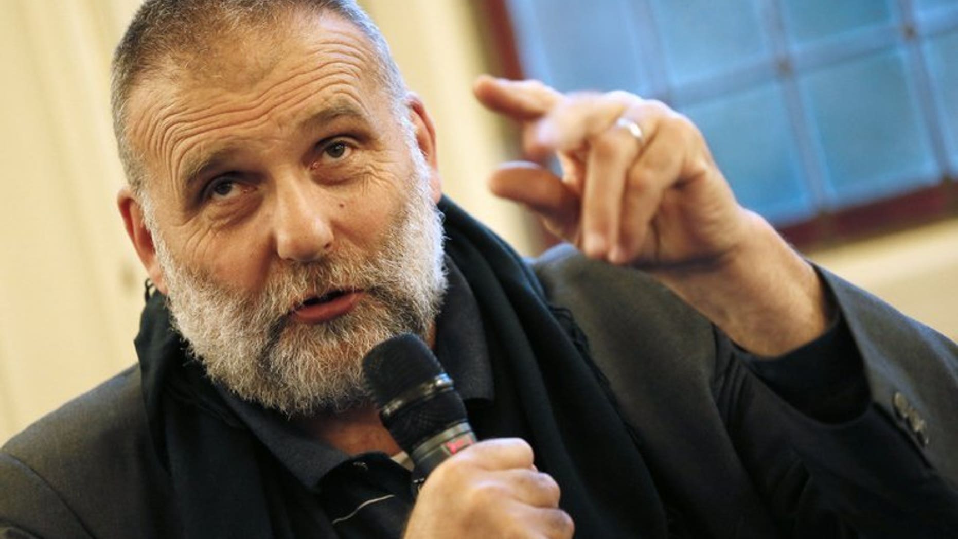 Italian Jesuit priest Paolo Dall???Oglio, expelled from Syria by Bashar al-Assad???s government in June 2012, takes part in a conference on the theme 'Syrian Christians' on September 25, 2012 in Paris. Conflicting reports emerged Tuesday over the fate of Dall???Oglio, known for opposing the Syrian regime, with some activists saying they feared he had been kidnapped by Al-Qaeda.