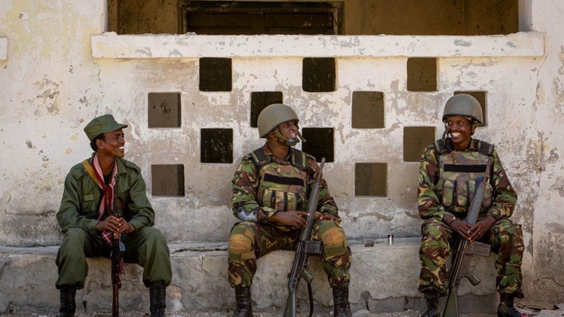 Soldiers of the Kenyan Contingent of AMISOM rest in the southern Somali port city of Kismayo on October 5, 2012. Two Kenyan officials kidnapped by the Somali Islamist group Shebab during an attack in northeastern Kenya in 2012 have been released, the Kenyan presidency announced Tuesday.
