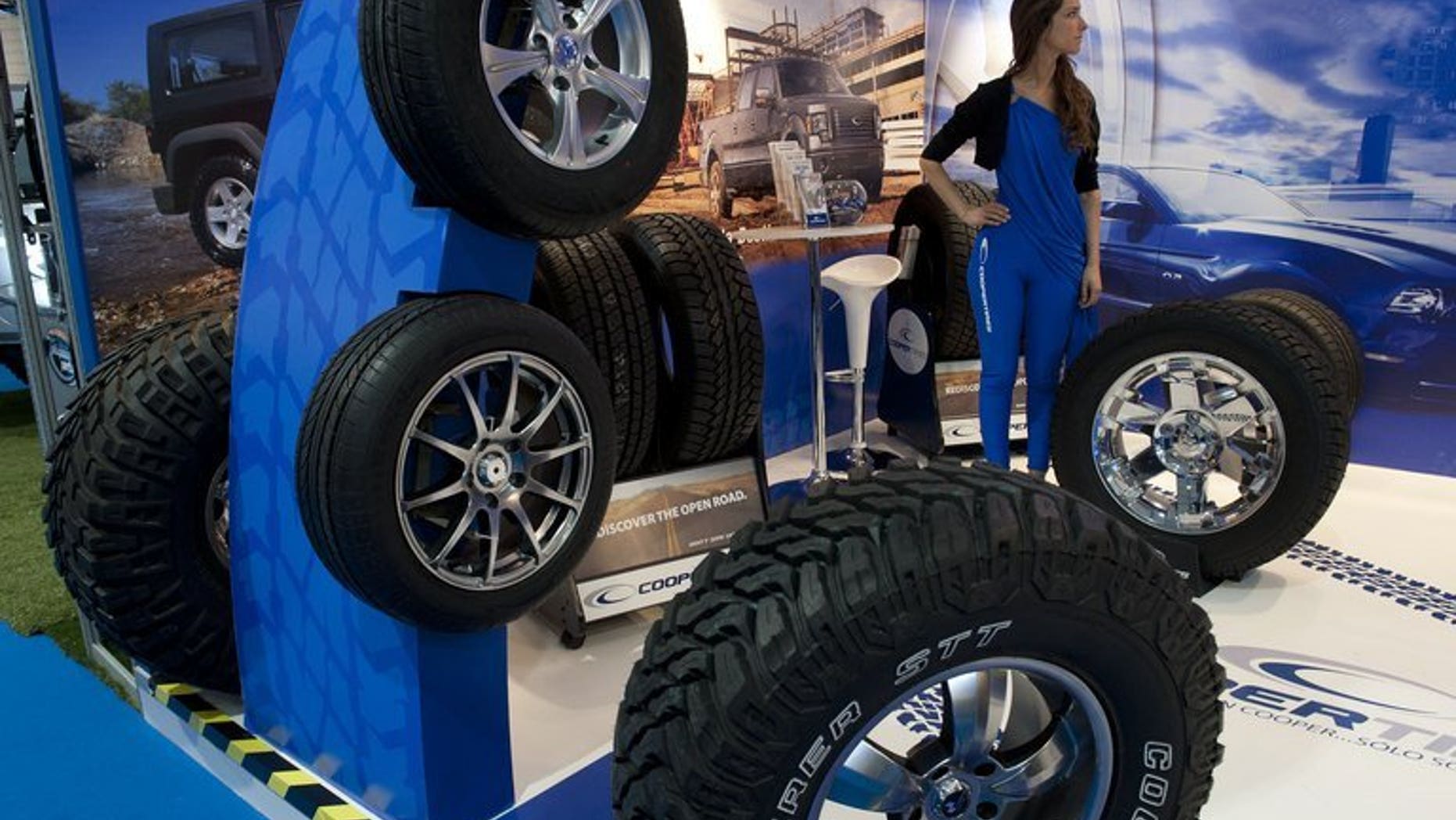 Cooper tyres are exhibited at a motor show in Santiago, on October 4, 2012. More than 5,000 Chinese workers at a Sino-US joint venture tyre manufacturer for Cooper Tireand Rubber have gone on strike against the American parent company's $2.5 billion takeover by an Indian firm, state media reported.