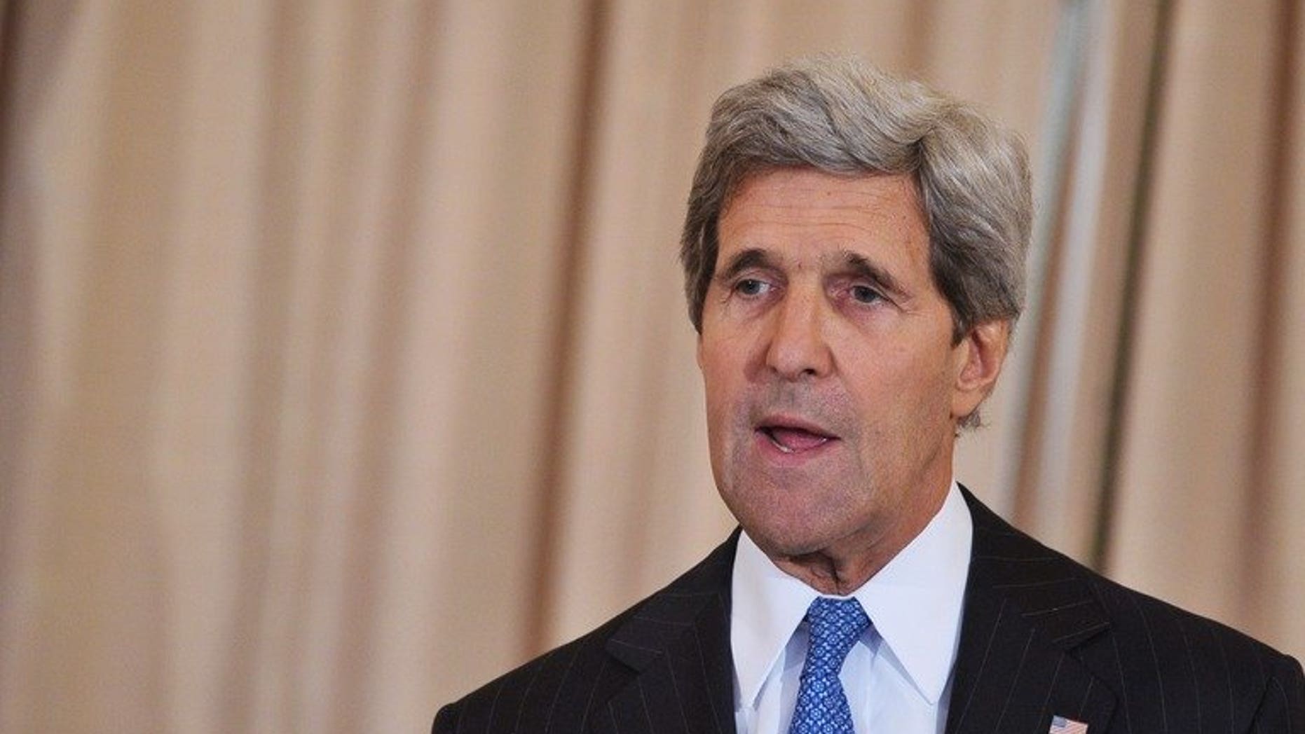 US Secretary of State John Kerry (R) speaks on July 24, 2013 at the State Department in Washington, DC. Kerry flew to Pakistan late Wednesday to press the new government on eliminating Islamist militant safe-havens as US-led troops prepare to leave Afghanistan.
