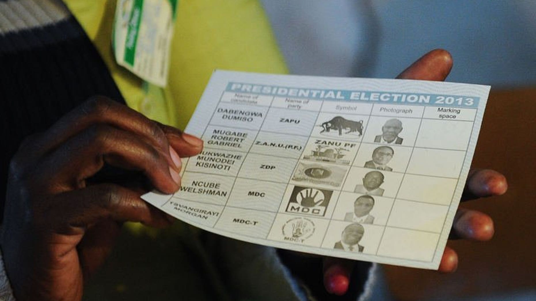 A Zimbabwean holds up a ballot at a polling station in Domboshava, north of Harare, on July 31, 2013, during the general election. The African Union's top poll observer said Zimbabwe's crunch presidential election Wednesday appeared, according to initial reports, to have passed off smoothly.