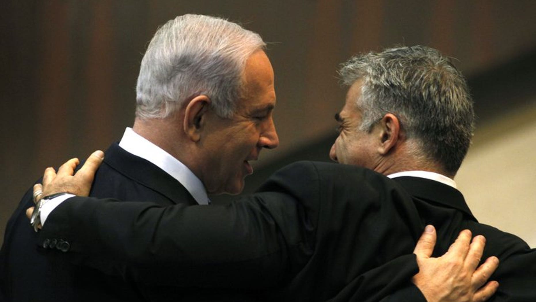 Israeli Prime Minister Benjamin Netanyahu (L) and Yair Lapid, during a parliament session on March 18, 2013 in Jerusalem. Economist Leo Leiderman was named Israel's central banker on Wednesday, days after the previous candidate pulled out after an investigation against him on a shoplifting allegation.
