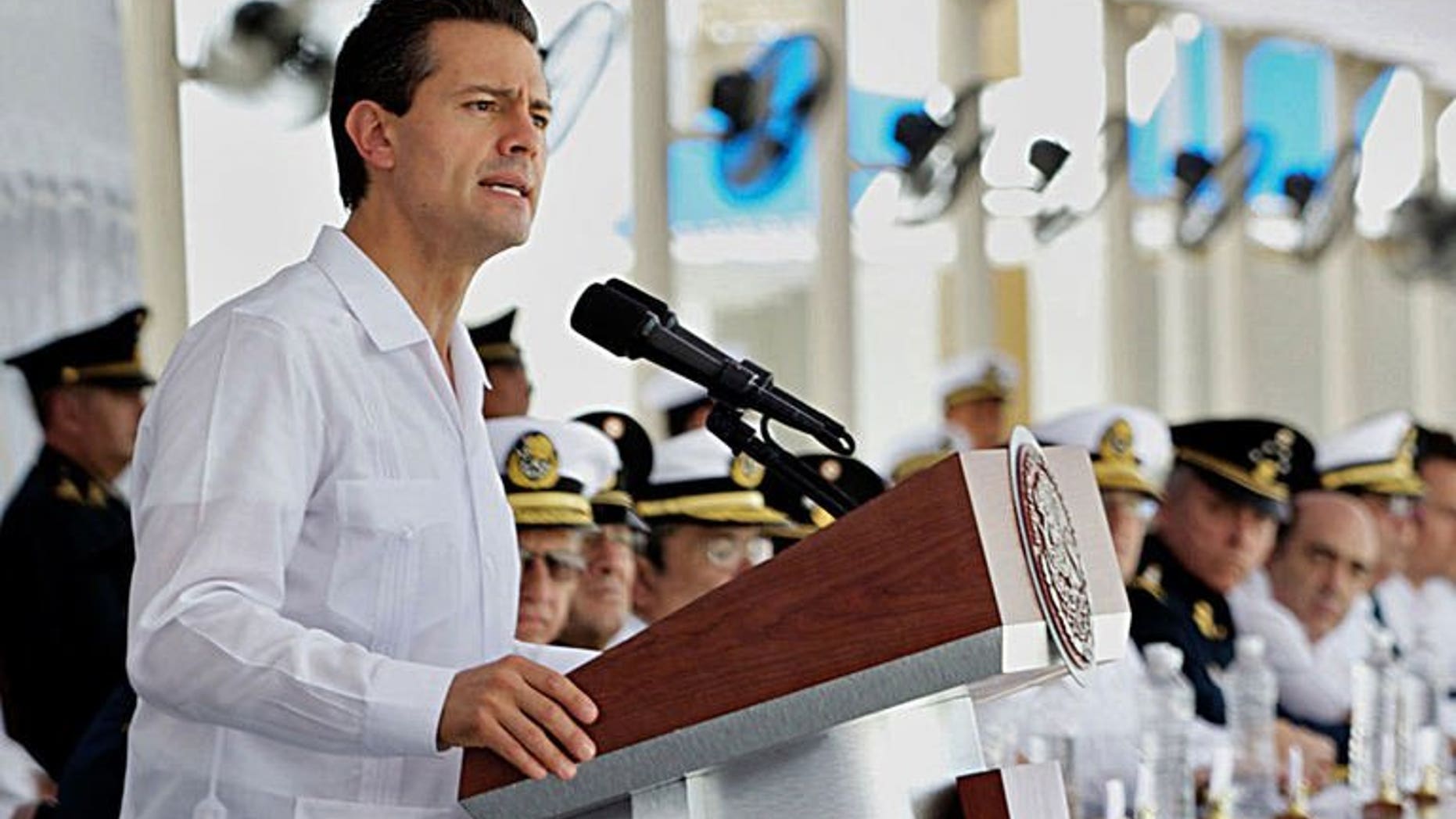Handout picture of Mexican President Enrique Pena Nieto delivering a speech at the headquarters of the Mexican Navy in Veracruz, Mexico on July 25, 2013. Nieto underwent a successful surgery to remove a benign thyroid nodule on Wednesday and he will rest for the next four days, his office and doctor said.