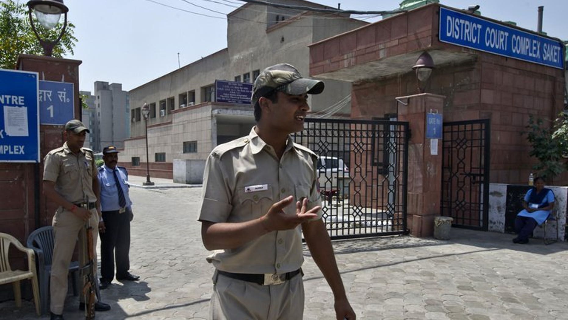 Indian police-men stand guard outside the Saket district court in New Delhi on April 8, 2013. The new police chief of India's capital said Wednesday his top priority was making the city safer for women after the fatal gang-rape of a student sparked violent protests.