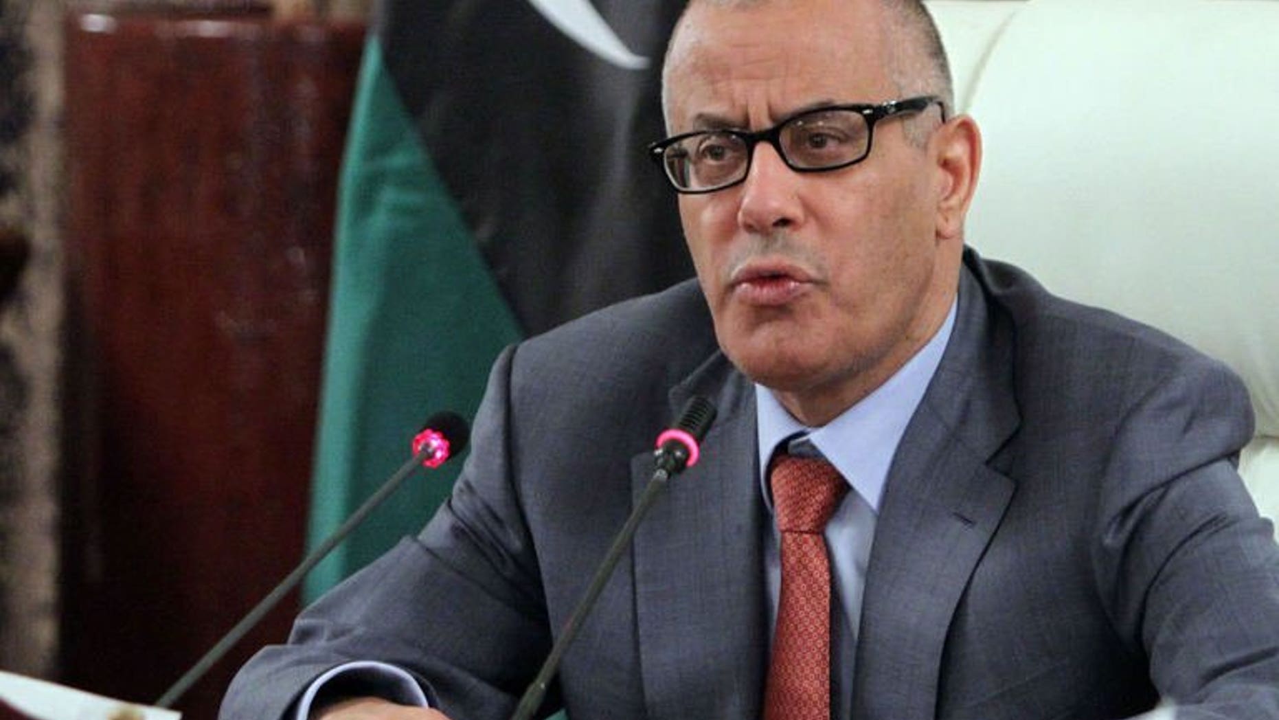 Libya's Prime Minister Ali Zeidan speaks during a press conference on July 31, 2013 in Tripoli. Zeidan said on Wednesday he had decided not to carry out an announced cabinet reshuffle aimed at resolving a political crisis and ending a wave of violence.