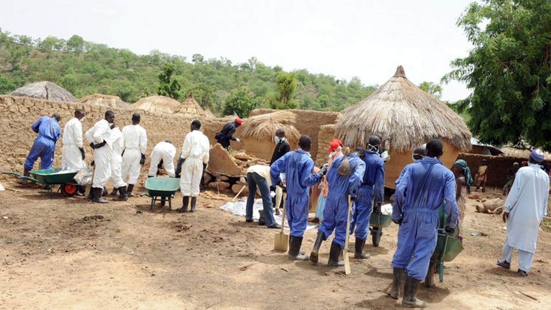 Health workers excavate soil contaminated with lead poison in Dareta village, in the Zamfara state on June 10, 2010. Medical charity MSF said Wednesday the Nigerian village that suffered an unprecedented and deadly lead poisoning outbreak had been cleared of the toxin, but that nearly 1,000 exposed children needed treatment.