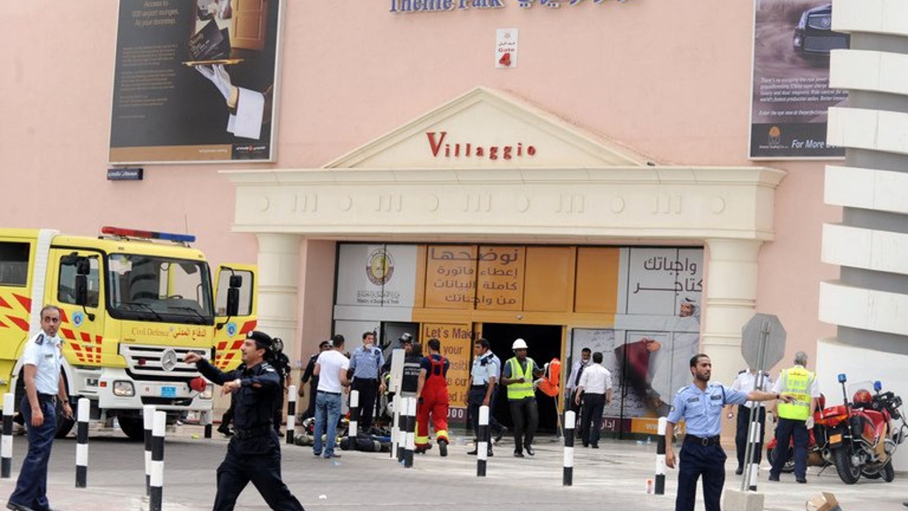 Qatari police clear traffic outside Doha's Villagio Mall after a fire broke out on May 28, 2012, killing at least 19 people, including 13 children. The parents of New Zealand triplets who died in the shopping mall fire, announced on Thursday that they have had baby twins.