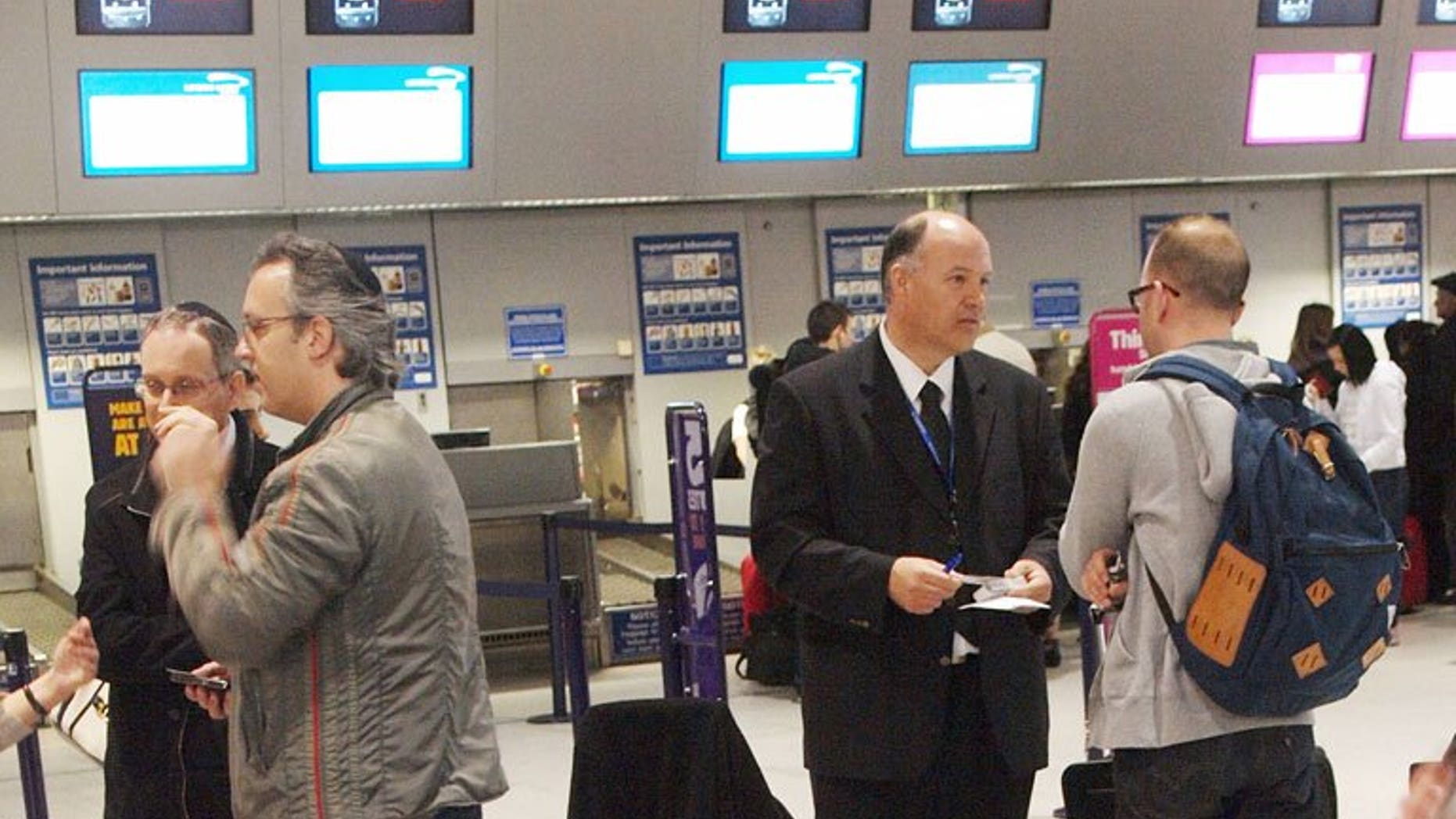 Passengers in the check-in area at Luton Airport north on London. Spanish infrastructure group Abertis said on Thursday it had agreed to sell London-Luton airport for 433 million pounds (502 million euros/$665 million) to a consortium led by Spain's airport operator.