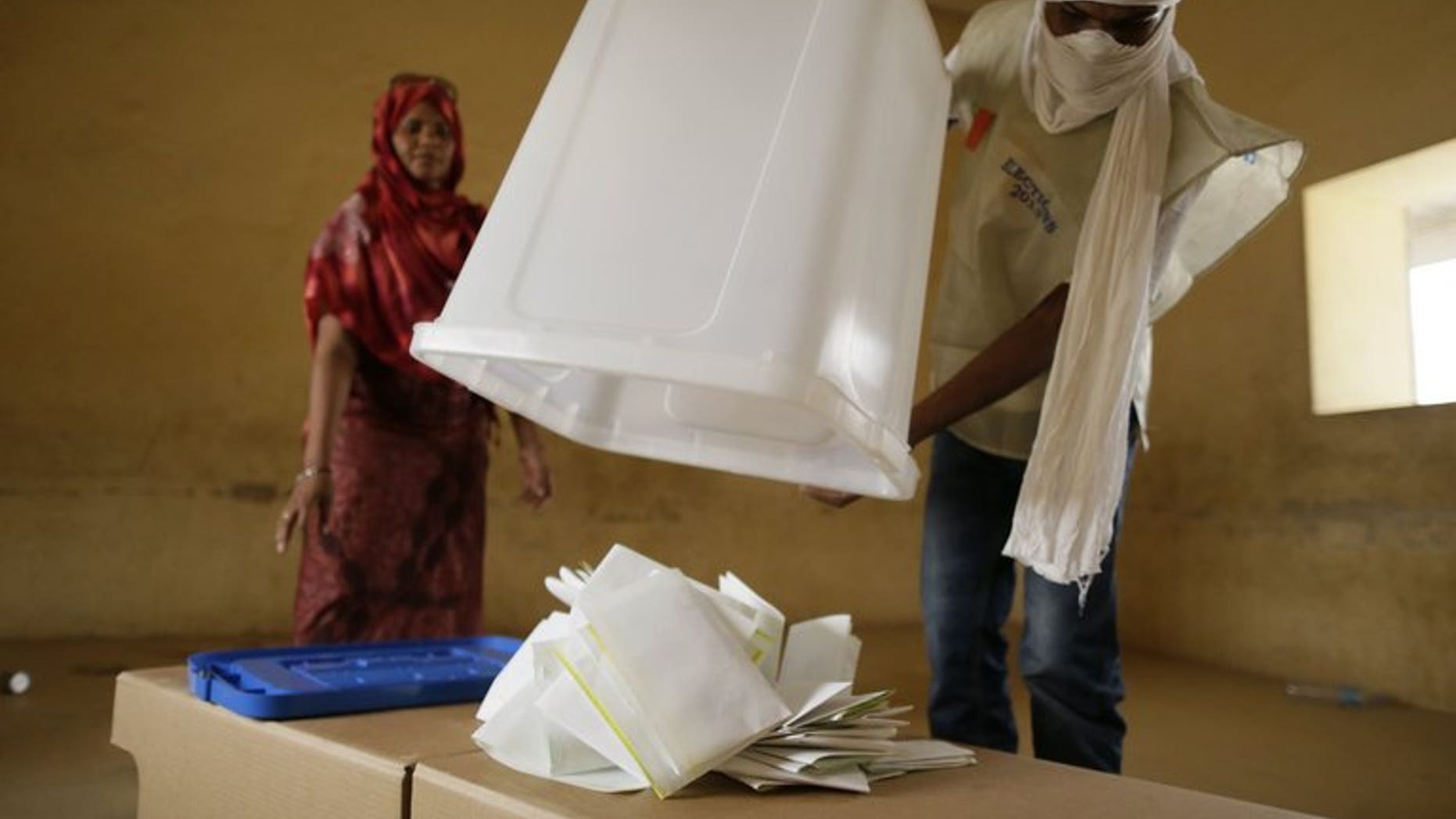 Malian electoral agents count the votes at a polling station in Kidal, northern Mali, on Monday. The results of the first round of Mali's presidential election will be announced on Friday, a day later than expected, the presidency said Thursday.