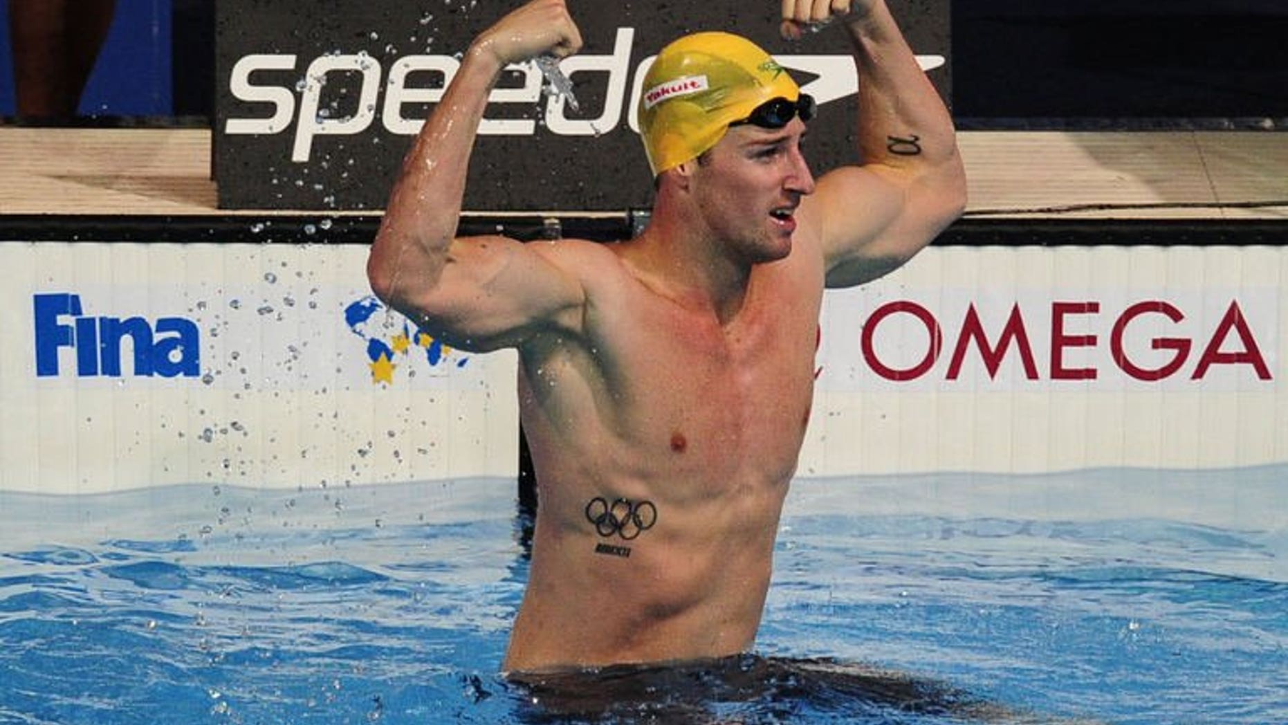 Australia's James Magnussen celebrates after winning the final of the men's 100-metre freestyle swimming event in the FINA World Championships at Palau Sant Jordi in Barcelona on August 1, 2013.