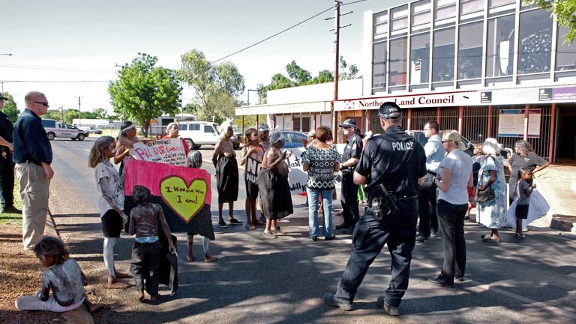 In this file photo, traditional owners of the Muckaty Aboriginal Land Trust protest on the national highway in Tennant Creek, a small town the Northern Territory, on April 2, 2012. An Australian mining firm was convicted on Friday of desecrating a sacred outback Aboriginal site, north of Tennant Creek, in a landmark ruling protecting the beliefs of the beleaguered minority in the country.