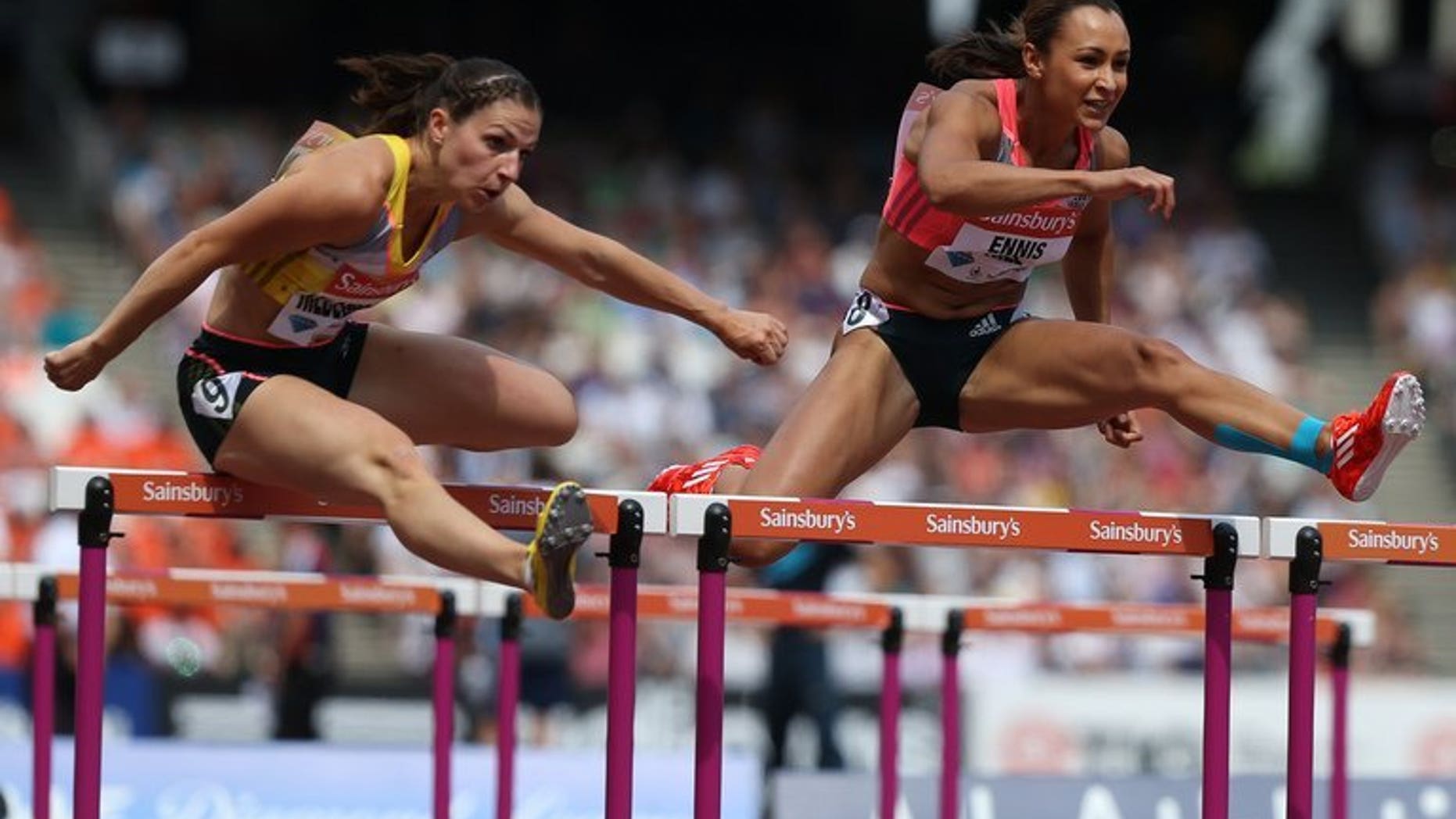 Jessica Ennis-Hill (right) outpaces Nadine Hilderbrand at the Anniversary Games in London on July 27. Ennis-Hill's coach expects the Olympic heptathlon champion to be sidelined for up to four months with the Achilles problem that forced her withdrawal from this month's world championships.