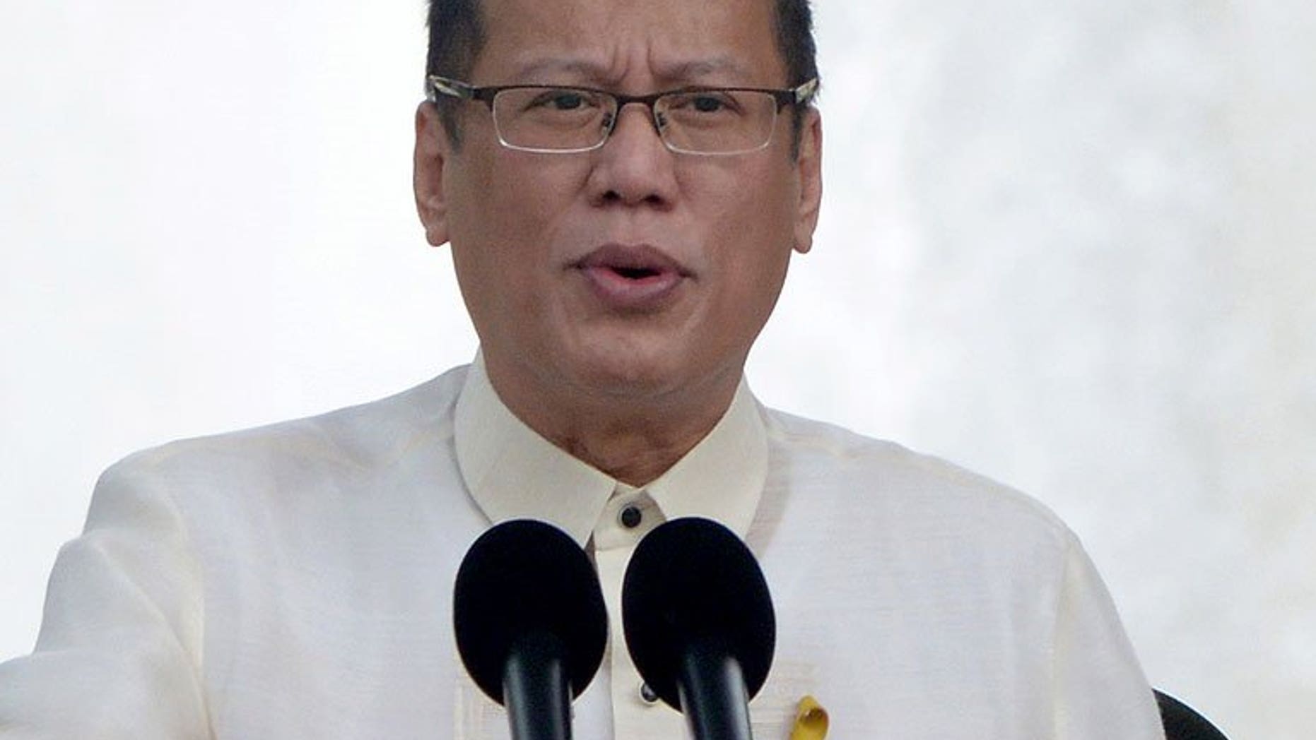 Philippine President Benigno Aquino addresses the crowd during a ceremony in Manila, on June 12, 2013. Thousands of workers will lose out when a plantation owned by Aquino's family is carved up for its farm hands next year, an official said Friday.