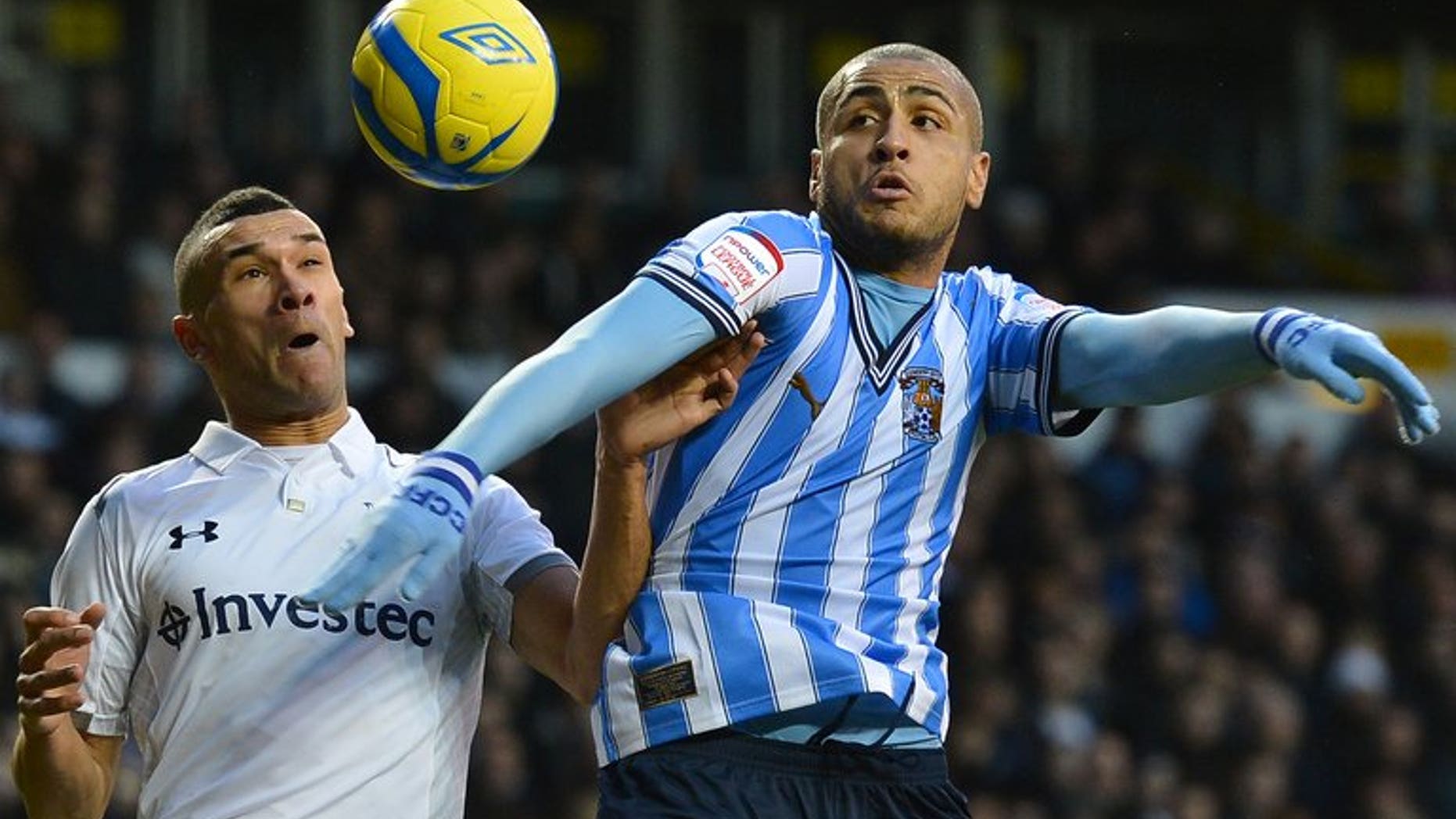 Coventry City's Leon Clarke (right) outjumps Tottenham's Steven Caulker in an FA Cup game at White Hart Lane on January 5. Coventry City said on Friday they were on the verge of liquidation, which will trigger a 15-point deduction just 24 hours before their 2013-2014 League One season begins.