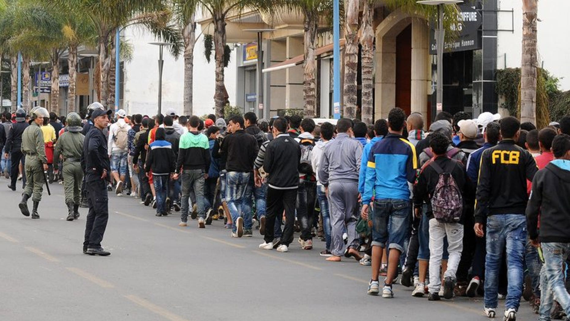 Supporters of Rabat FAR football club arrive at the Mohamed V complex on April 11, 2013 in Casablanca. A Moroccan court handed more than 130 people accused of football hooliganism before a match in Casablanca sentences of up to three years in prison, a judicial source said on Friday.