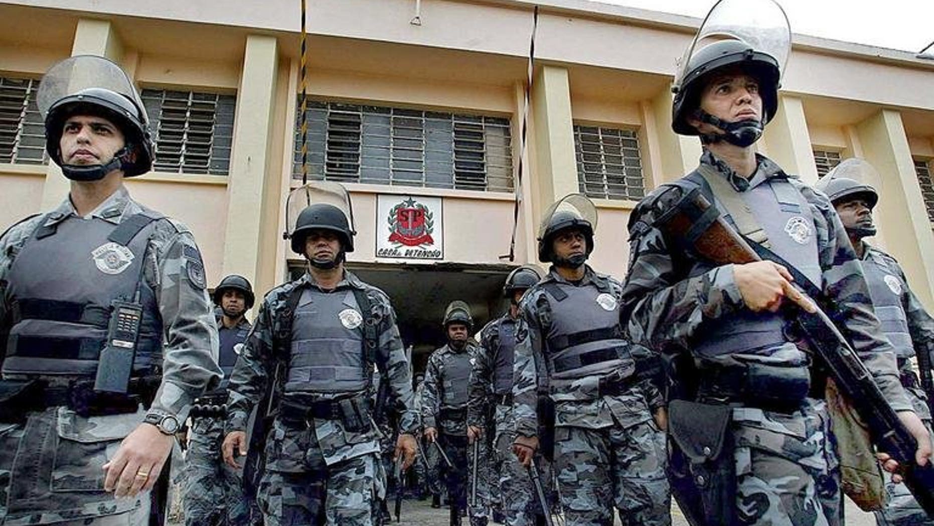 Brazilian anti-riot police provide security at the Carandiru jail 15 September 2002 in Sao Paulo, Brazil. Twenty-five police officers have been sentenced to life in prison for their role in the 1992 Carandiru prison massacre that left 111 prisoners dead.