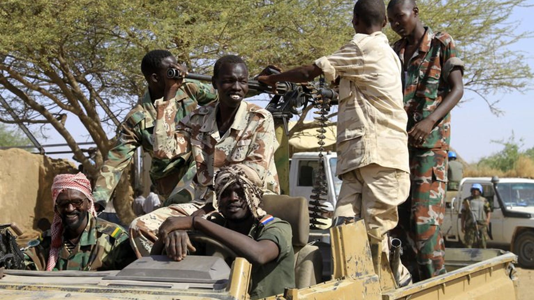 Sudanese soldiers keep watch in the Shangil Tobaya area for displaced people in North Darfur state, on June 18, 2013. A new outbreak of tribal violence in Darfur region has killed nine people, official media said, in fighting that has added to worsening insecurity in the region.