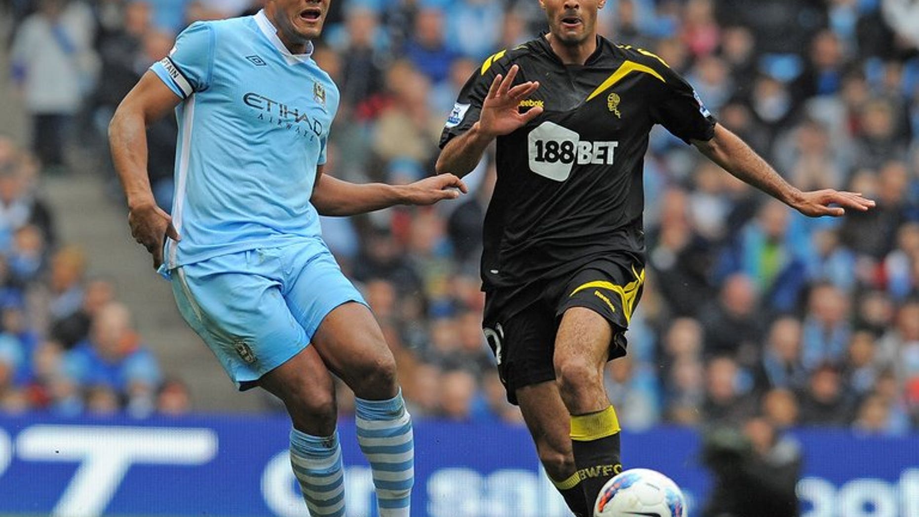 Bolton's Darren Pratley (right) plays during an English Premier League football match in Manchester on March 2012. Bolton came from behind to rescue a 1-1 draw at local rivals Burnley in the opening game of the 2013-14 Championship season.