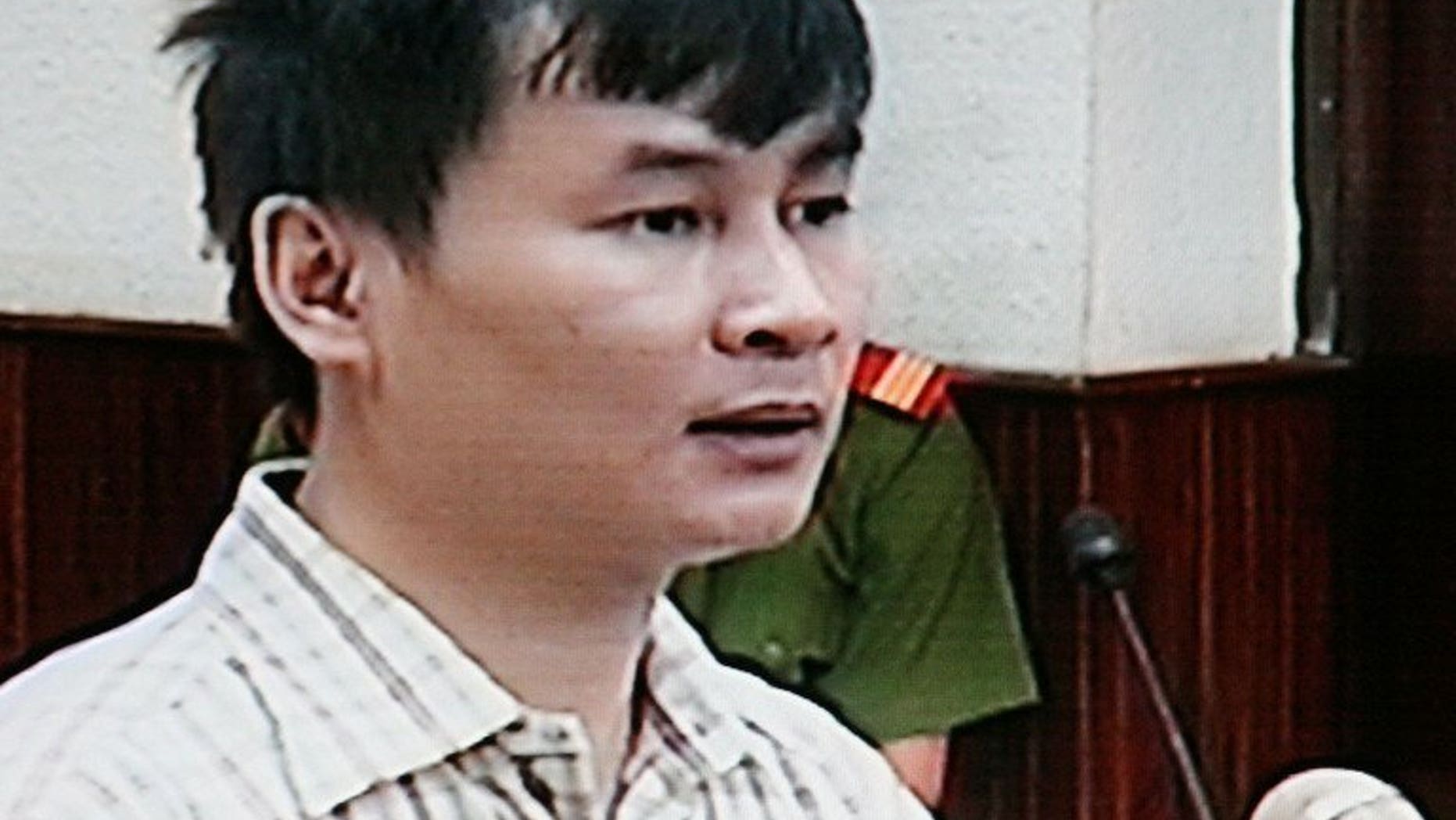 This file photo from a closed-circuit television on October 14, 2008 shows Vietnamese reporter Nguyen Van Hai at his trial at Hanoi's people court. jailed for 12 years for anti-state propaganda, Hai has ended a lengthy hunger strike after authorities agreed to investigate complaints about prison treatment, his son said Saturday.