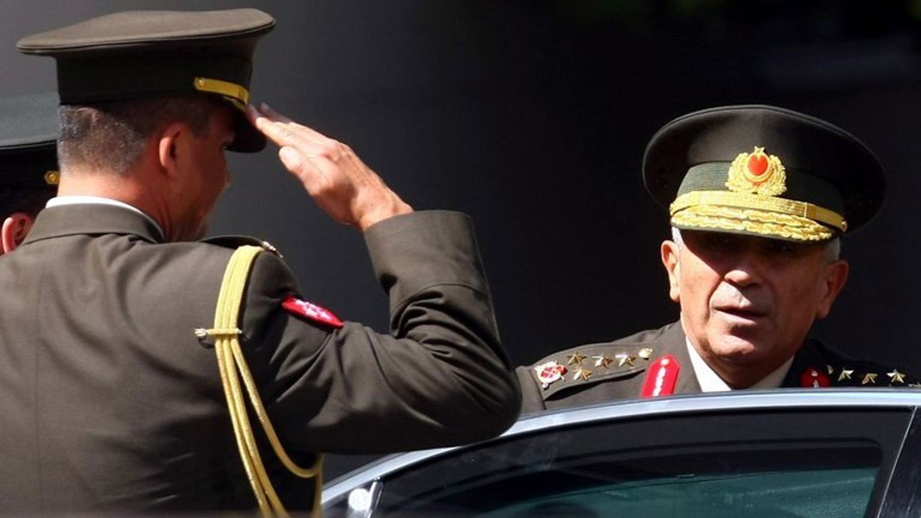Turkey???s Commander Bekir Kalyoncu (R) arrives for a security meeting in Ankara on August 4, 2011. Prime Minister Recep Tayyip Erdogan decided on the forced retirement of General Bekir Kalyoncu, who had been expected to become land forces commander.